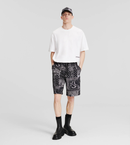 A model in black and white KLJ Bandana-Print Shorts from Karl Lagerfeld