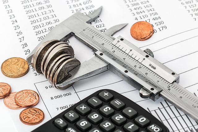 Corporation tax calculator with coins and financial documents