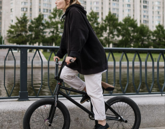 A woman riding her 1000w electric bike on the streets in the city
