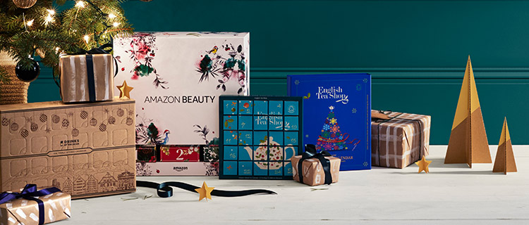 Image: Presents, products and mini paper trees from Amazon sitting under a Christmas tree Presents, products and mini paper trees from Amazon sitting under a Christmas tree