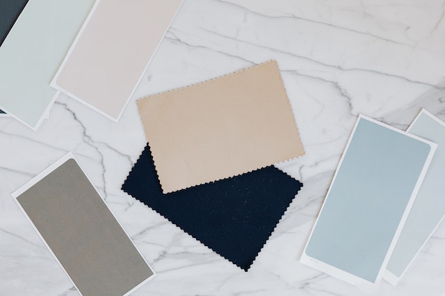 What is Planner 5d: Paint and fabric swatches on a marble countertop