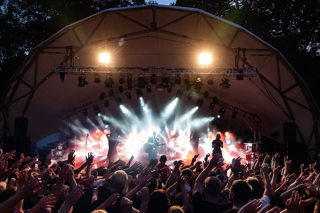A crowd in front of a stage with fireworks at one of the best music festivals in the world