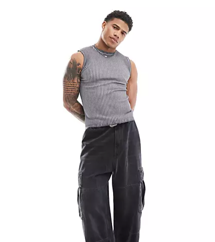 A model wearing the ASOS DESIGN Muscle Tank Vest from ASOS