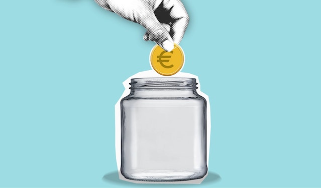 A hand dropping a coin into a jar after hearing about the UK interest rate forecast