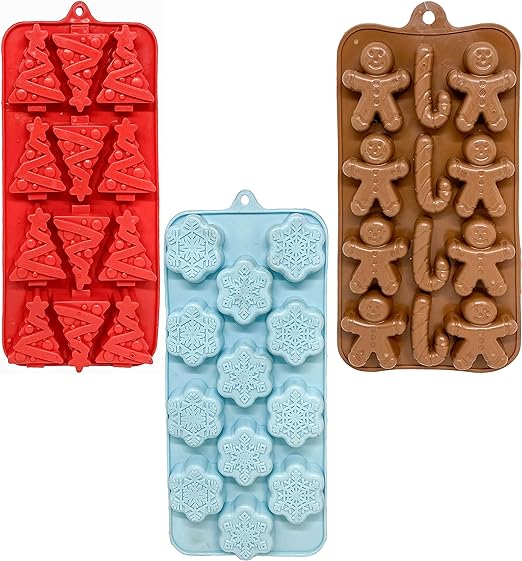 A blue, red and brown Christmas ice cube trays floating on a white background