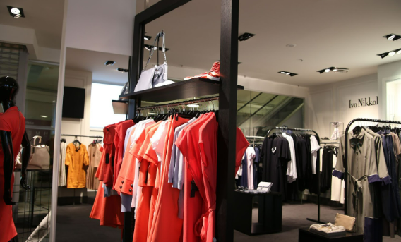 Various dresses hung up in the Monsoon Dresses UK store.