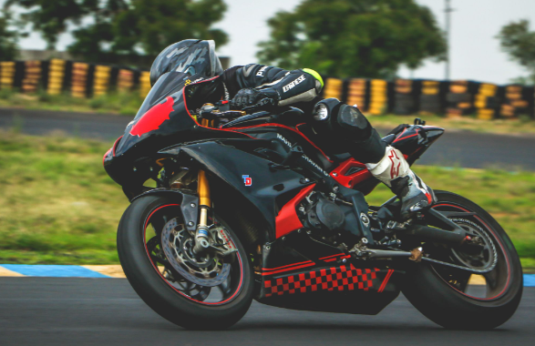 eBay for motorcycles: A professional motorcycle racer, racing on a red and black motorcycle
