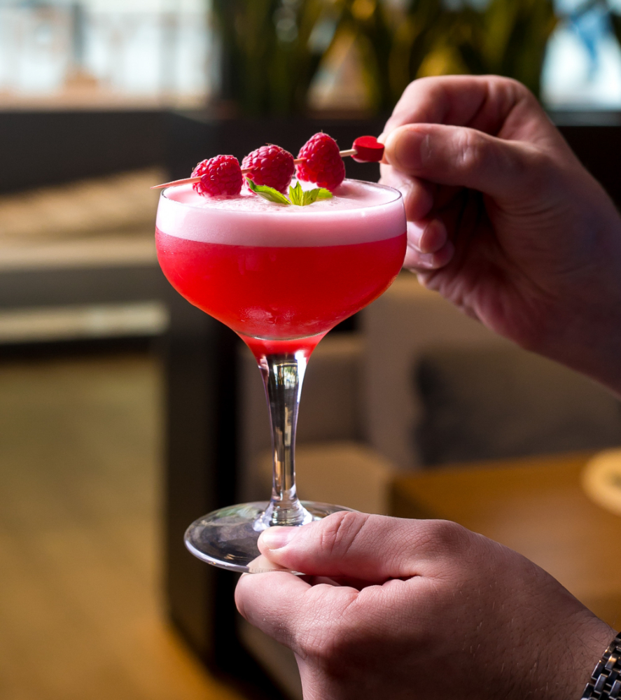 Prosecco Cocktails With Vodka: Vodka glass with raspberries on top