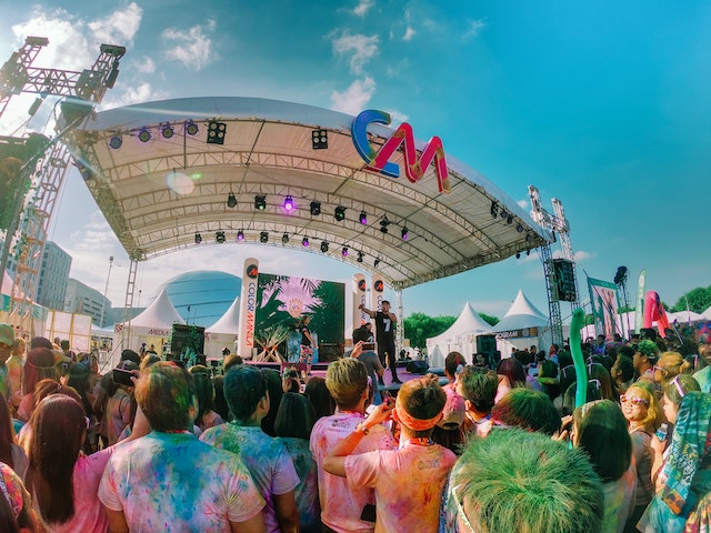 A crowd in front of a stage at one of the best music festivals in the world