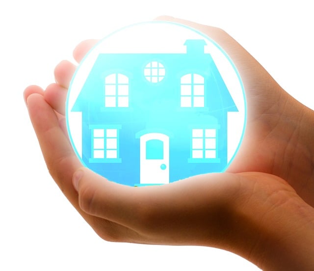Lit up house on the palm of a pair of hands for Direct Line Insurance