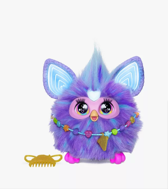 best toys for Christmas: A purple Furby standing next to a gold comb on a white background