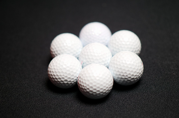 7 best cheap golf balls on a black background
