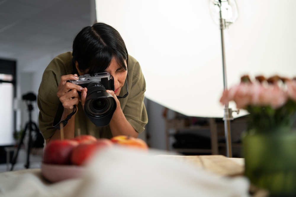 Image: Celebrate World Photography Day: A person taking a picture of fruits that are blurred out Celebrate World Photography Day: A person taking a picture of fruits that are blurred out