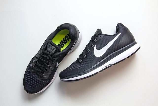 Nike running shoes for men: A pair of black and white Nike Zoom running shoes