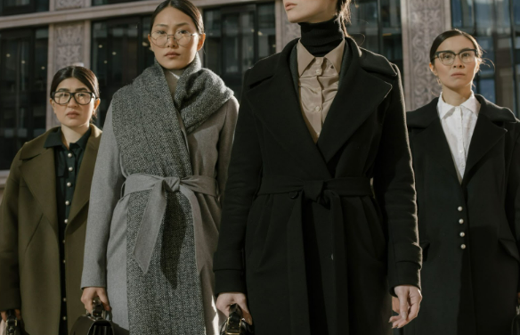 Four women wearing coats from Dorothy Perkins online store.