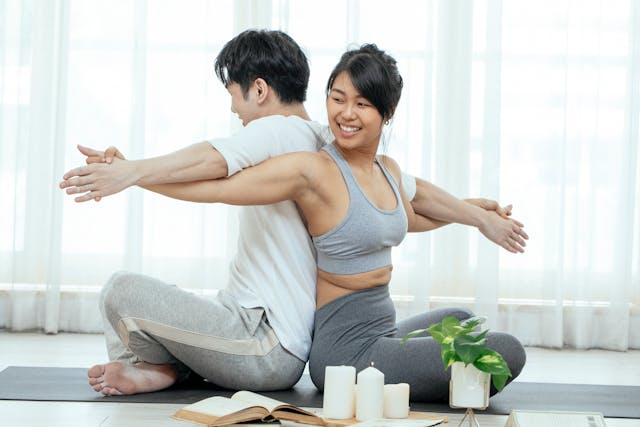 Image: What is acroyoga?: A couple trying out acroyoga for beginners What is acroyoga?: A couple trying out acroyoga for beginners