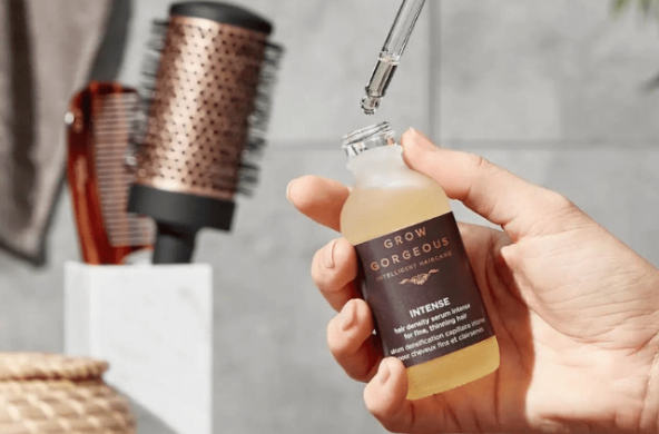 Image: A hand-holding hair care product from the professional hair care product range. A hand-holding hair care product from the professional hair care product range.
