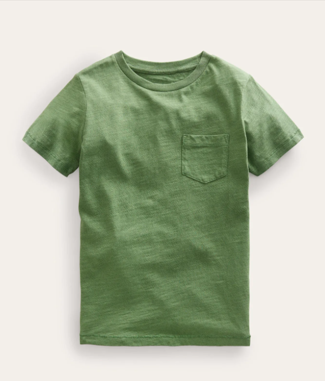 Image: Boden baby boy clothes: a deep green t-shirt with a pocket laying on a beige background Boden baby boy clothes: a deep green t-shirt with a pocket laying on a beige background