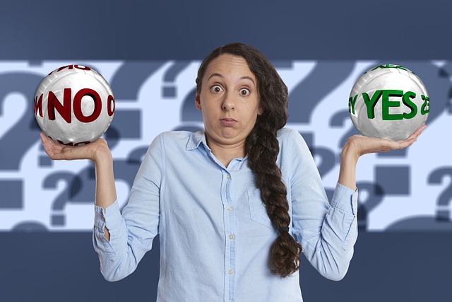 Image: Saving for a mortgage: Woman holding up arms with a ball in each hand with a green yes and red no caption written on the balls. Saving for a mortgage: Woman holding up arms with a ball in each hand with a green yes and red no caption written on the balls.