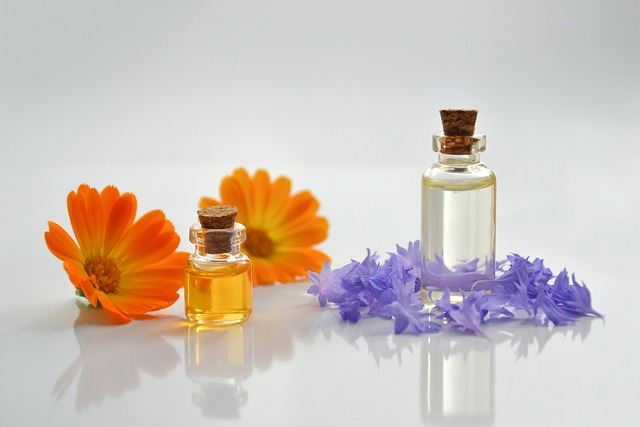 Debenhams men’s fragrance sale: Perfume oils in bottles with orange flowers on the side and purple lavender on the right