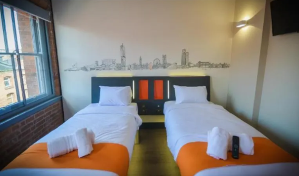 Image: A bedroom with two single beds at the Easyhotel Manchester: A cheap hotel in Manchester A bedroom with two single beds at the Easyhotel Manchester: A cheap hotel in Manchester