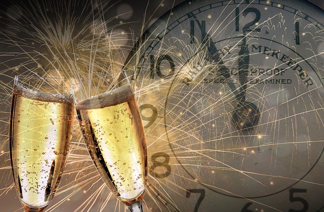 Easy nibbles to have with drinks: Two champagne glasses and a clock in the background