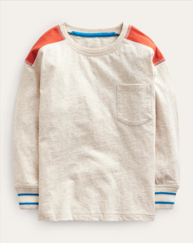 Image: An off-white, blue and orange long-sleeved shirt laying on a beige background An off-white, blue and orange long-sleeved shirt laying on a beige background