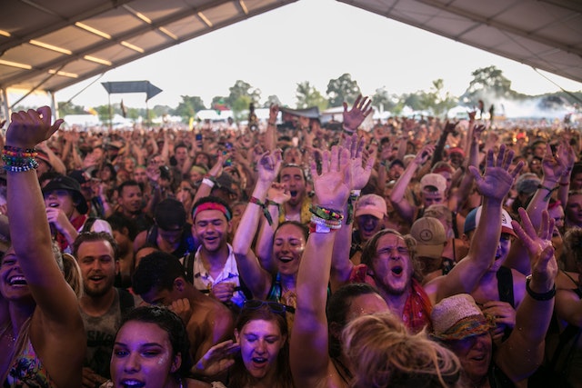 A crowd having fun outdoors at one of the best music festivals in the world