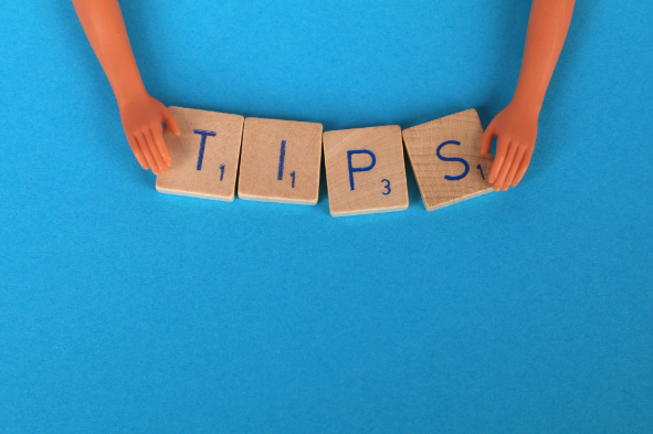 Blocks that spell out the word ‘TIPS’ for tips and tricks for cheap garden rattan furniture.