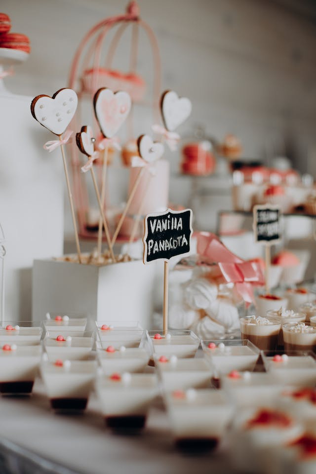 Ben & Jerry's valentines ice cream: Rows of mini panna cottas laying on a table with signs and decor