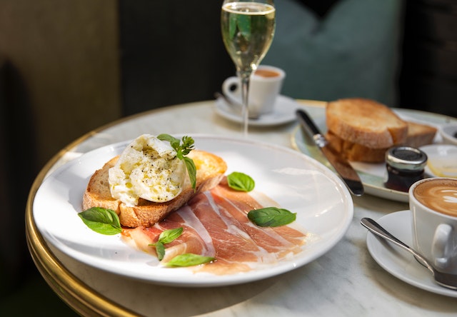 Image: The best bottomless brunch in London served on a white porcelain plate The best bottomless brunch in London served on a white porcelain plate