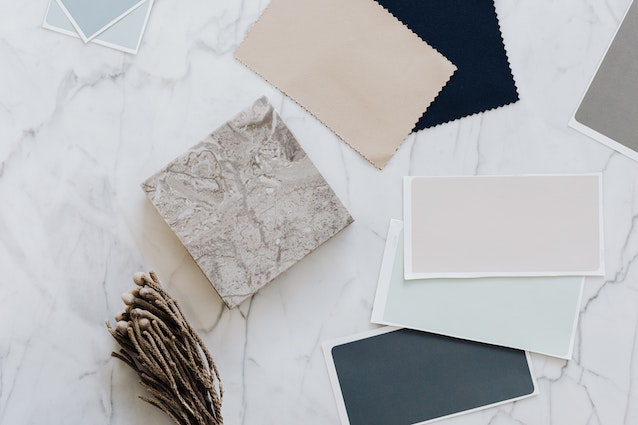 Planner 5d app: Paint and material swatches resting on a marble countertop