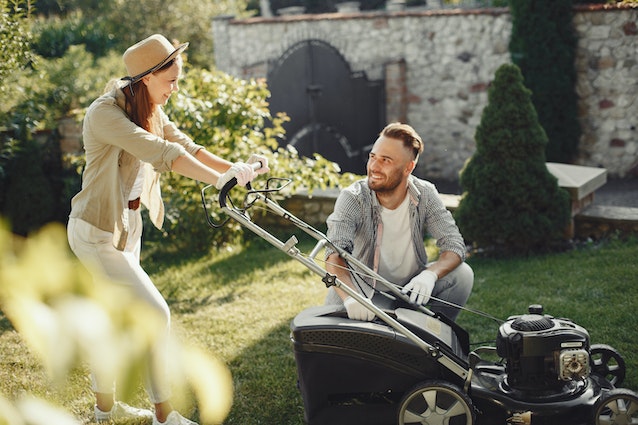 Image: A couple mowing their lawn on a Sunday afternoon with the best cordless lawn mower A couple mowing their lawn on a Sunday afternoon with the best cordless lawn mower