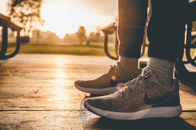 Nike Air running shoes: A man outside wearing grey Nike running sneakers