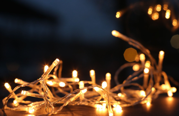 Outdoor Christmas light decorations that are switched on and arranged on a table.