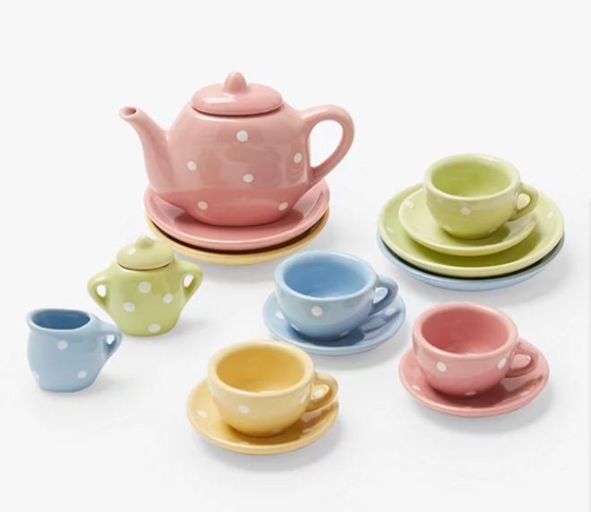 A fifteen-piece John Lewis toy fine china tea set sitting on a white background