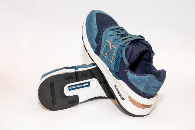 A multi-coloured pair of Men’s trainers at Schuh with a New Balance Logo on the side of the trainer.