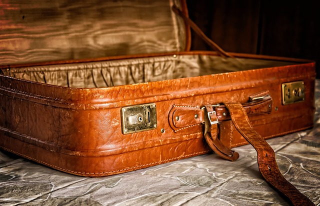Leather bags at Debenhams: An opened brown leather suitcase lying on the concrete floor.