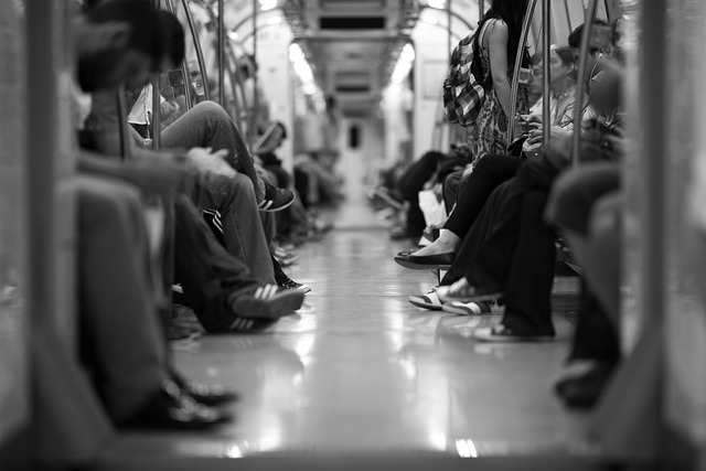 How To Get Group Save On Train Tickets: A train wagon filled with people doing a variety of things.