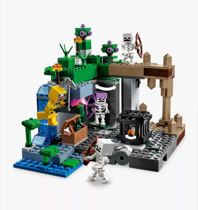 A LEGO Minecraft skeleton dungeon standing in front of a white background