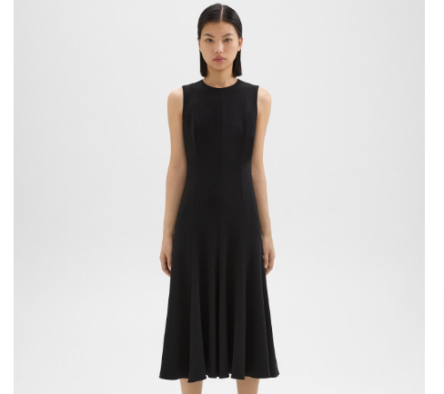 A woman wearing a black sleeveless flare dress from Theory Clothes on sale selection.