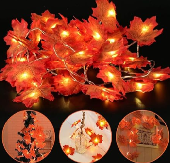 Outdoor Christmas light decorations: LED leaf lights switched on and placed on a table