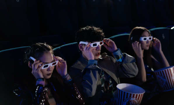 People wearing 3D glasses in a 4DX Cinema