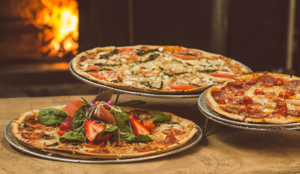 Three pizzas made from an italian pizza recipe