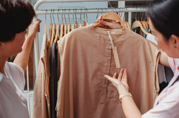 Two women shopping for the best selling items from Dorothy Perkins UK