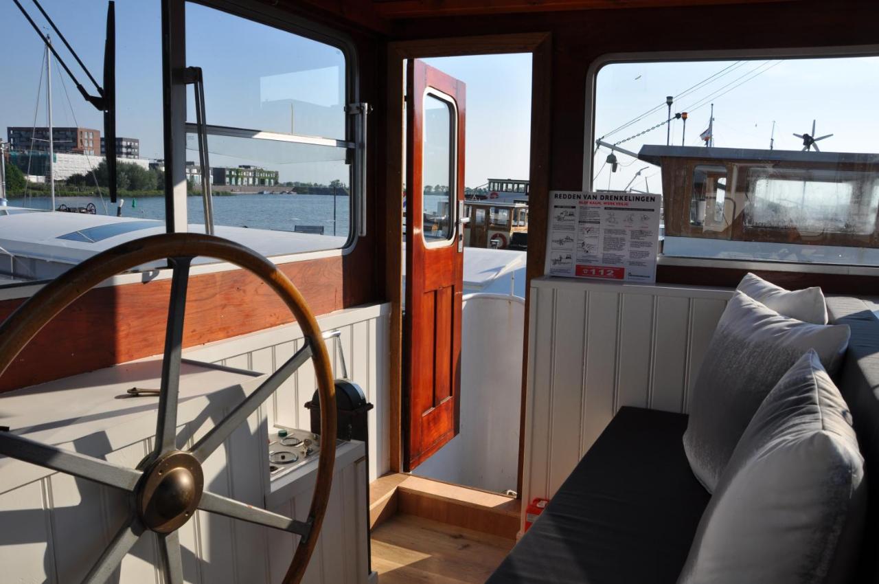 Image: Booking.com hotels and rentals: The interior of a houseboat showing the open front door Booking.com hotels and rentals: The interior of a houseboat showing the open front door