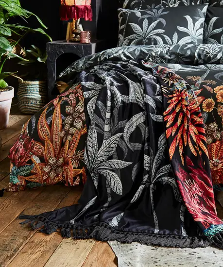 bohemian bedroom decor ideas: a bed clad in bedding from the Endless Sunsets collection