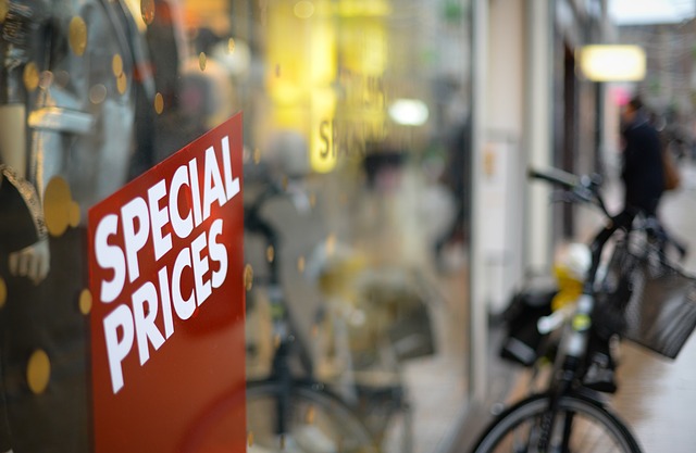 Majestic Wine offers Red special prices board outside a shop with a bicycle on the blurry background.