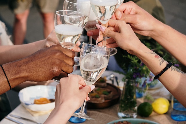Image: A group of friends toasting with glasses of wine at one of the best brunch spots in London A group of friends toasting with glasses of wine at one of the best brunch spots in London