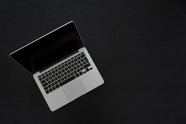 Best cheap laptops: An open laptop placed on a black surface